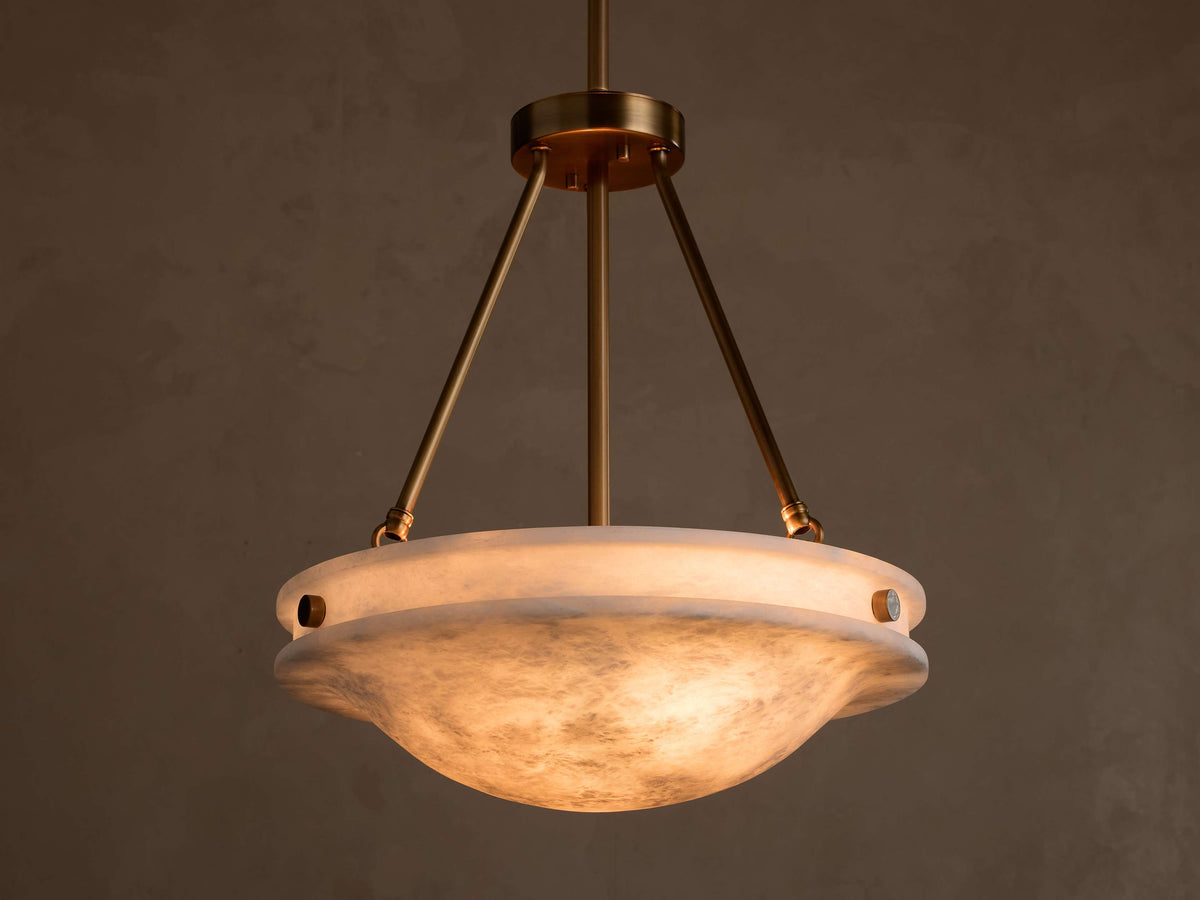 Illuminated Edith alabaster bowl pendant suspended from brass-toned hardware