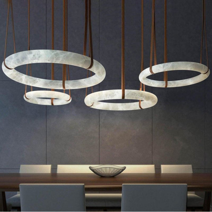 Pale alabaster ring chandeliers with strap suspension in a catalog room scene