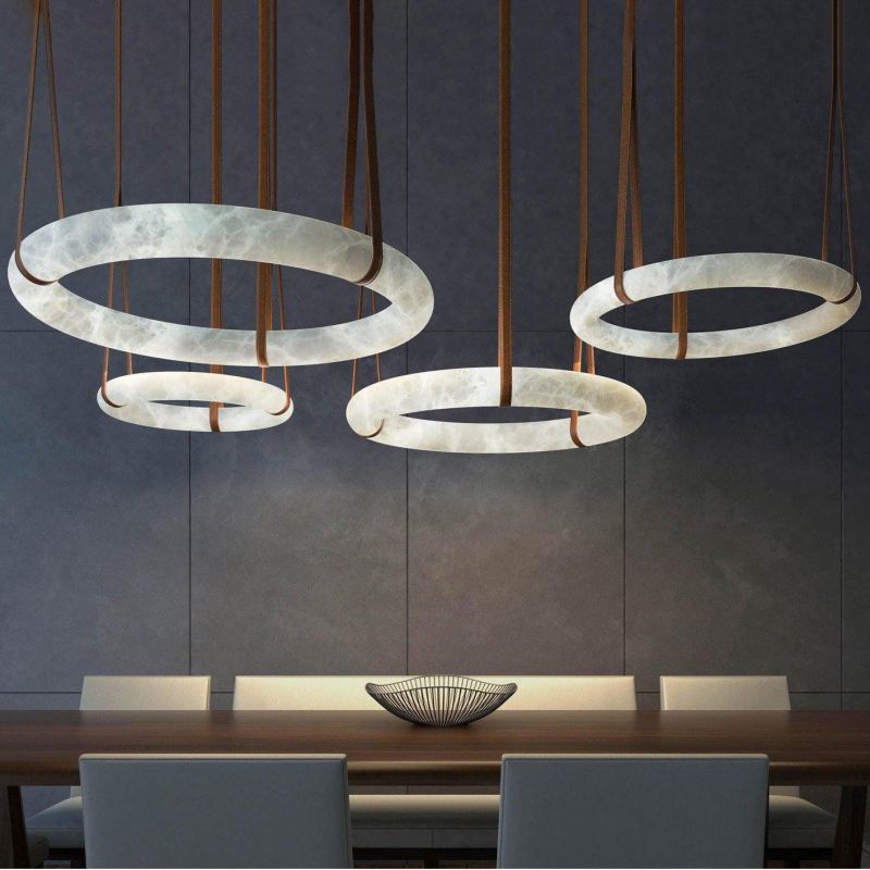 Pale alabaster ring chandeliers with strap suspension in a catalog room scene