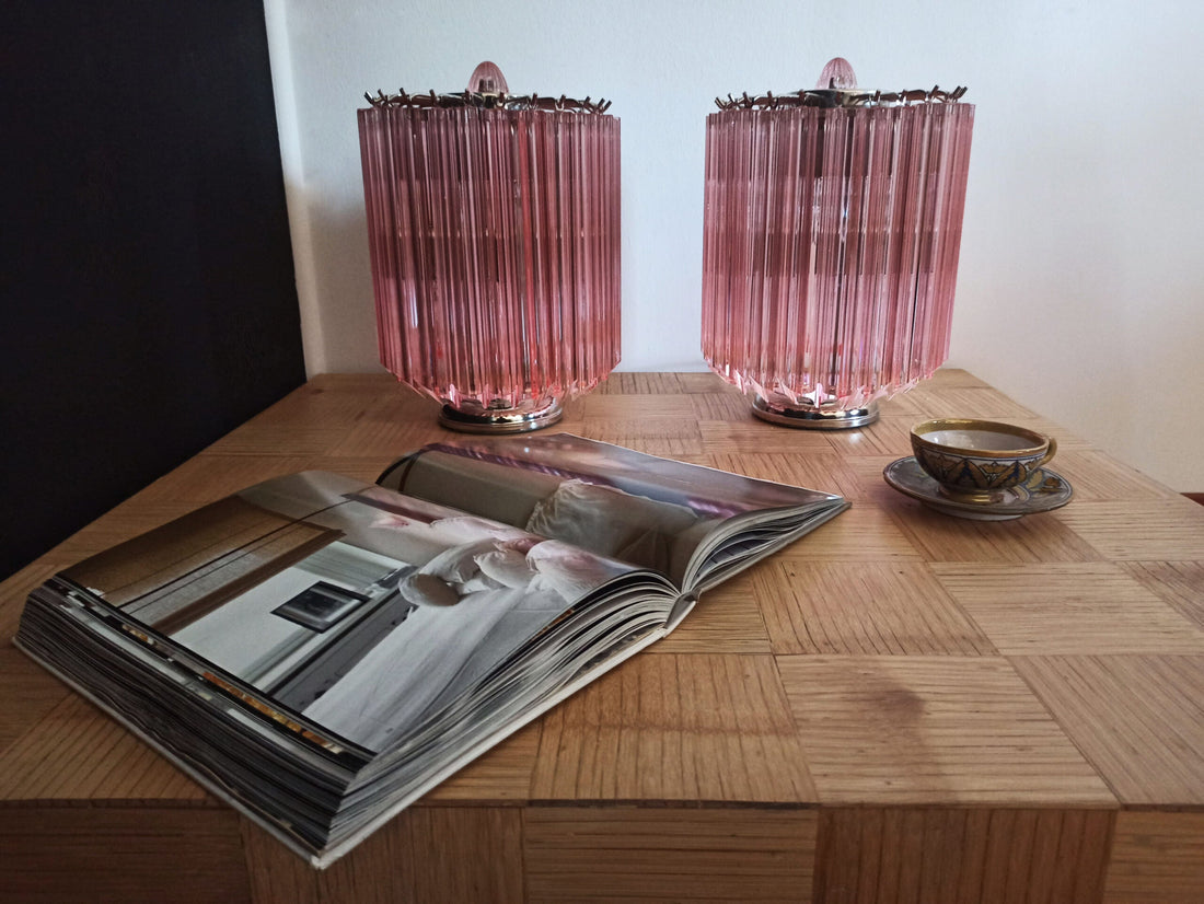 Pair of pink prism-glass table lamps on a wooden surface