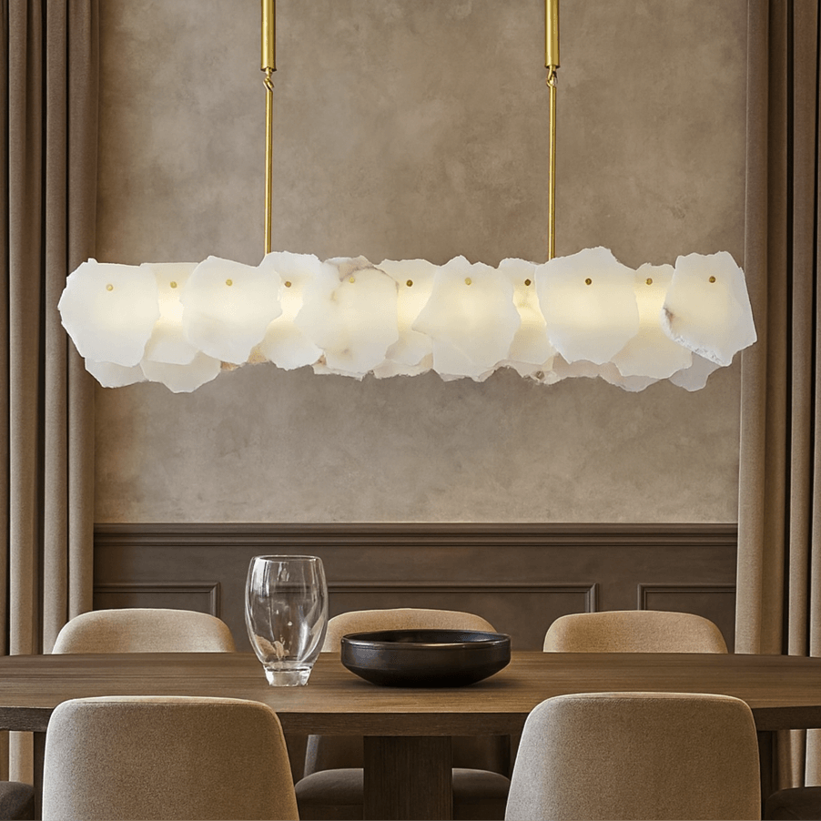 Norham linear chandelier with overlapping irregular pale stone shades along a horizontal body