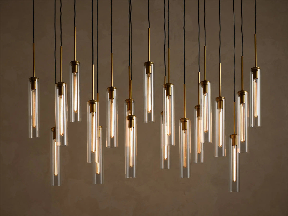 Colleena linear chandelier with fluted glass cylinders at staggered heights