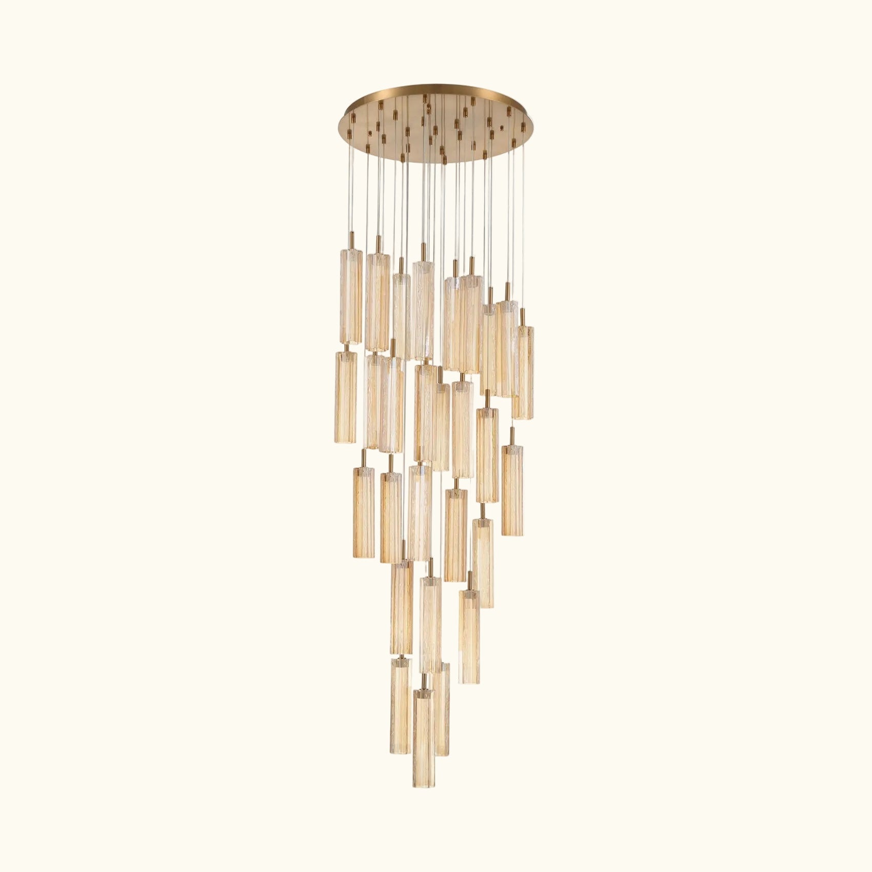 A modern multi-light linear chandelier with a brushed gold circular canopy and multiple clear glass cylinder shades of varying lengths, suspended against a plain white background.