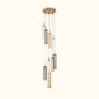 Modern chandelier with cylindrical glass shades on a white background