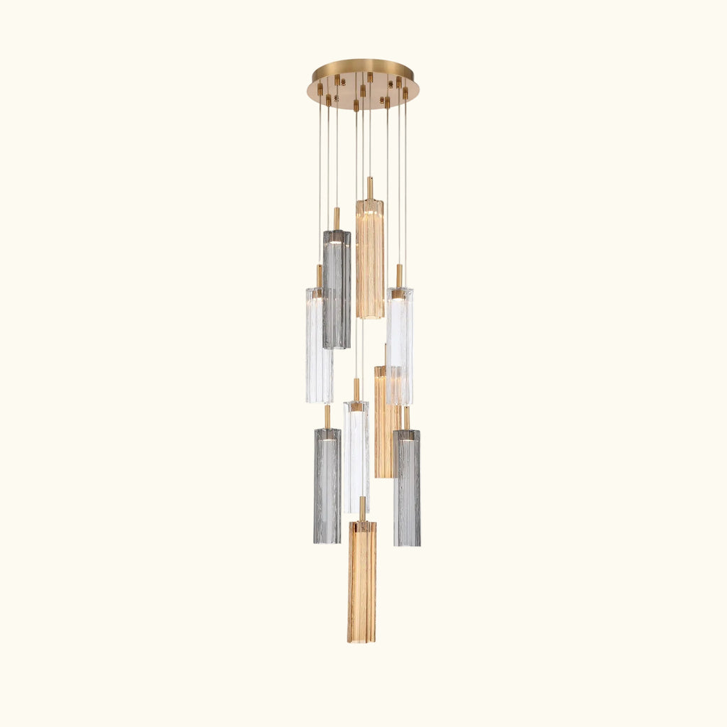 Modern pendant light with cylindrical glass shades on a white background