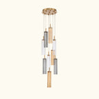 Modern pendant light with cylindrical glass shades on a white background