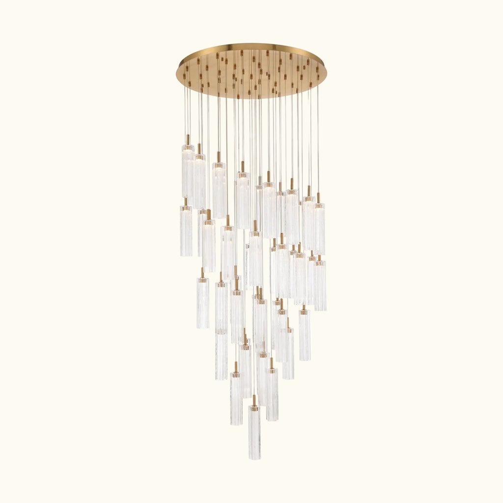 Chandelier with gold fixture and clear glass shades on a white background