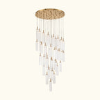 Chandelier with gold fixture and clear glass shades on a white background