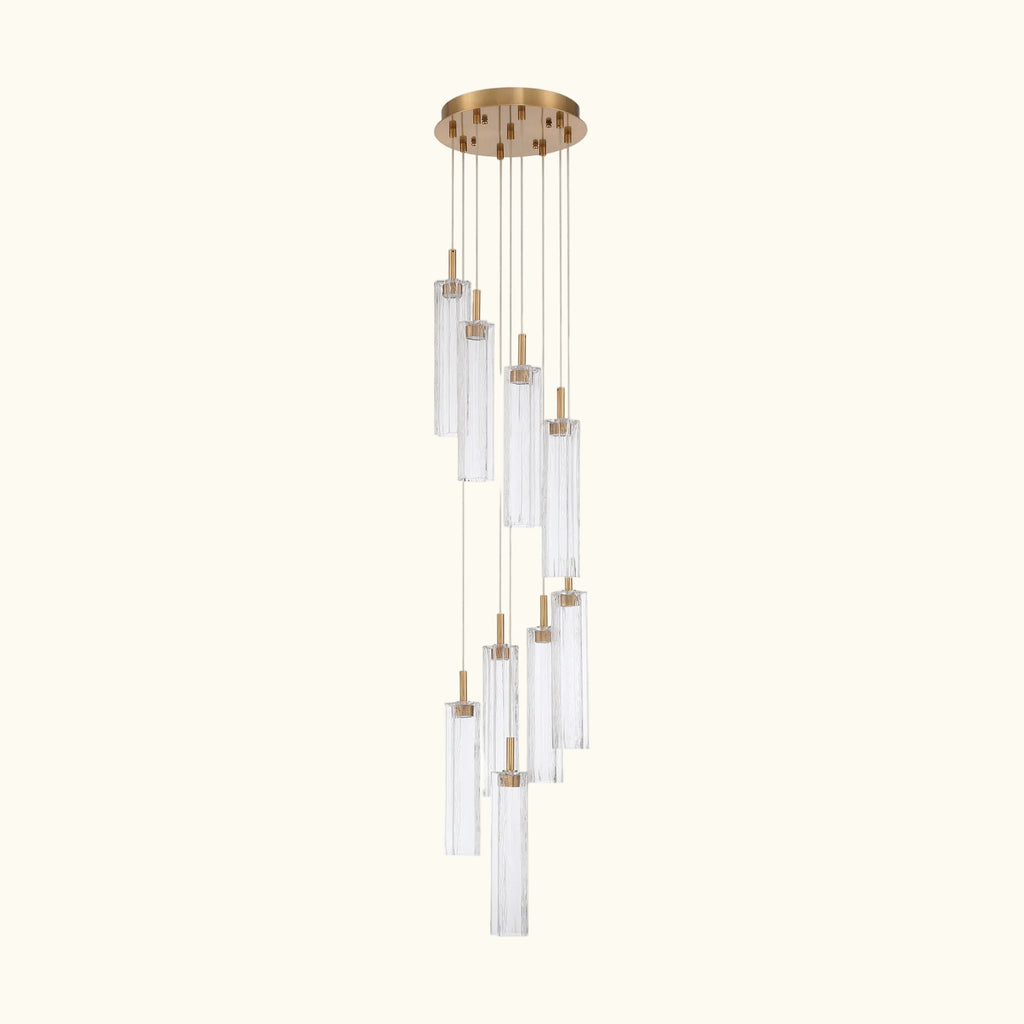 Chandelier with clear glass shades and gold accents on a white background