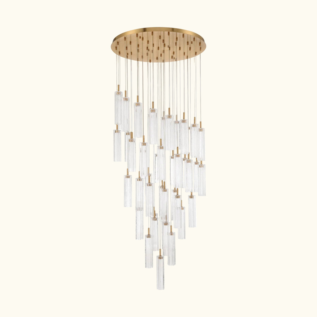 Chandelier with gold fixture and clear glass tubes on a white background