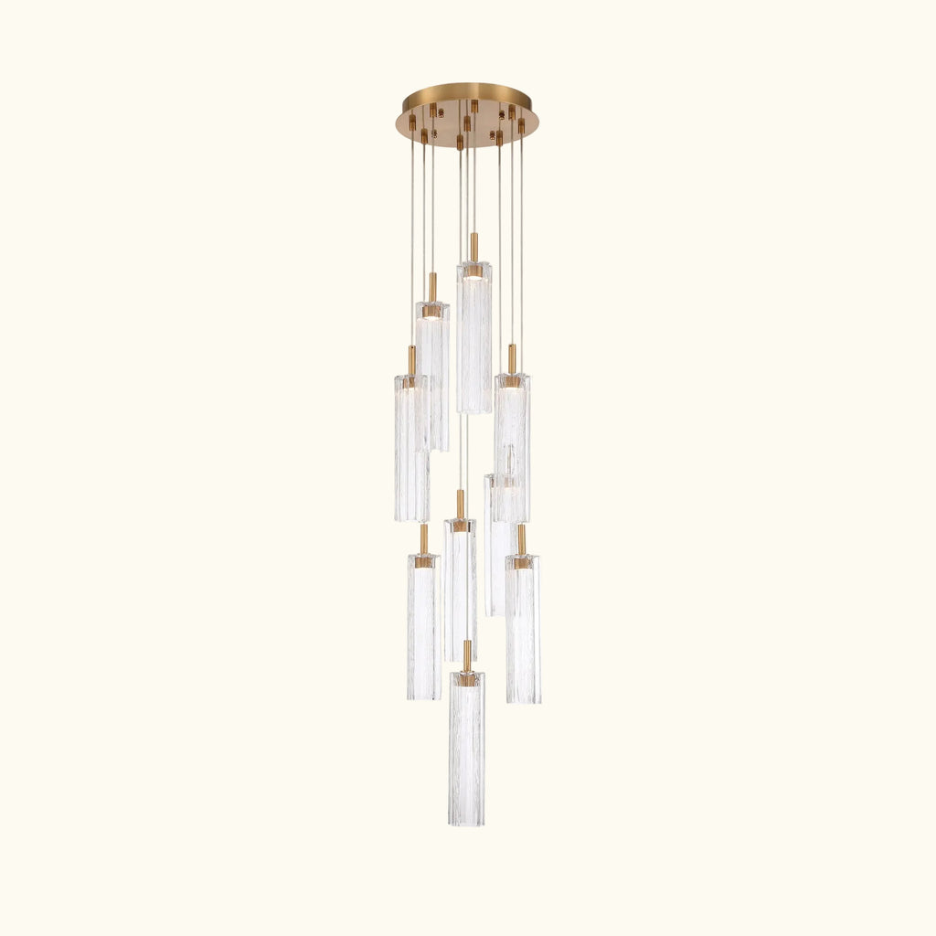 Chandelier with clear glass shades and gold accents on a white background