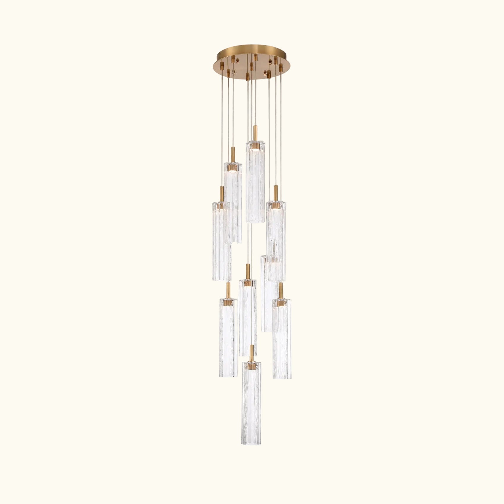 Chandelier with clear glass shades and gold accents on a white background