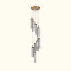 Modern chandelier with cylindrical glass shades on a white background