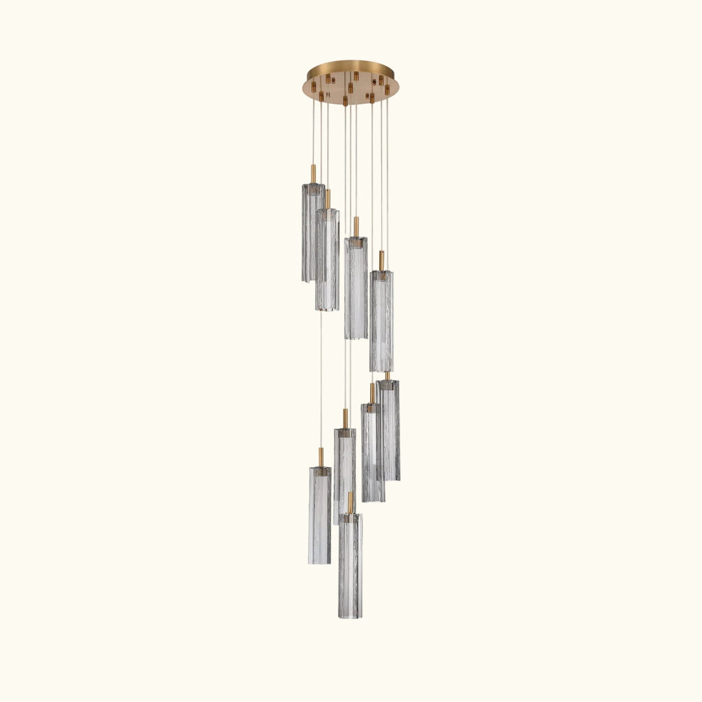 Modern chandelier with cylindrical glass shades on a white background