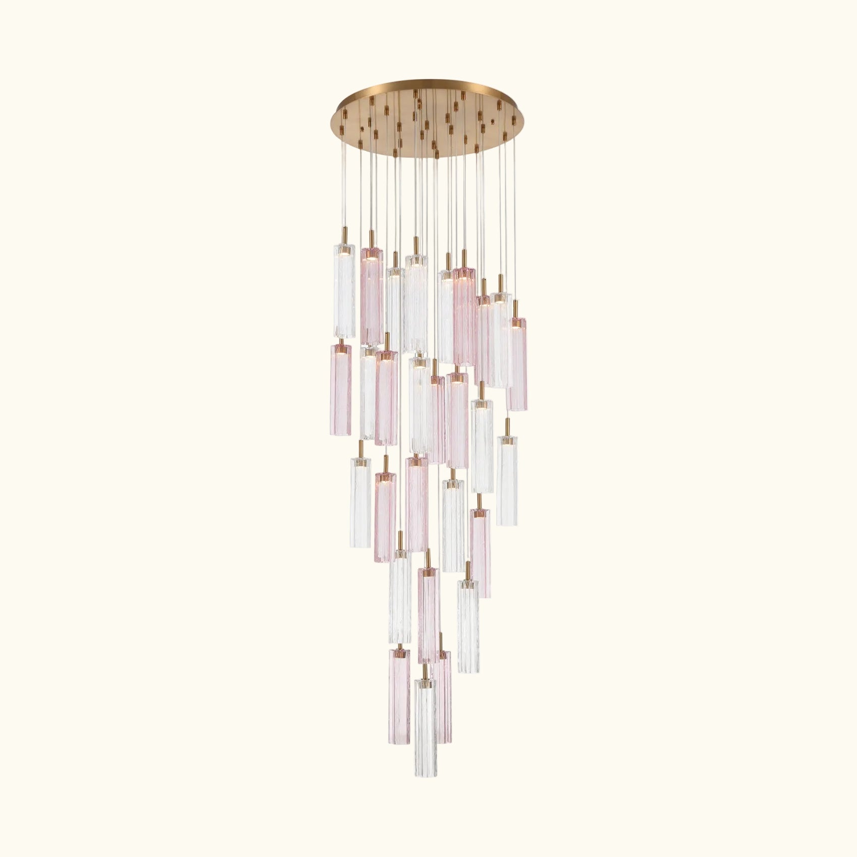 A modern multi-light linear chandelier with a brushed gold circular canopy and multiple clear glass tubes with soft pink tinted sections, suspended against a plain white background.