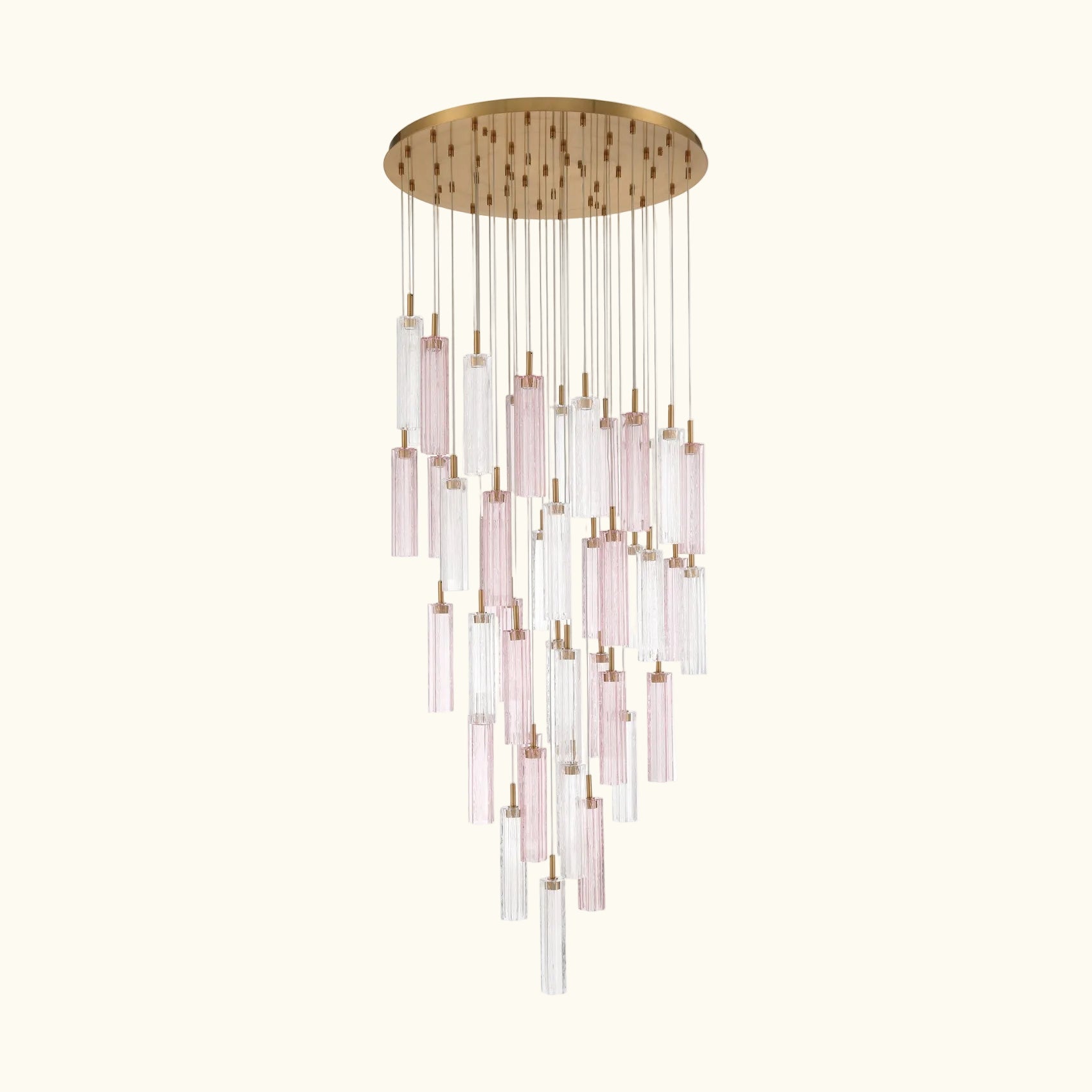 A modern multi-light linear chandelier with a brushed gold circular canopy and multiple clear glass tubes with a soft pink tint, suspended against a solid white background.