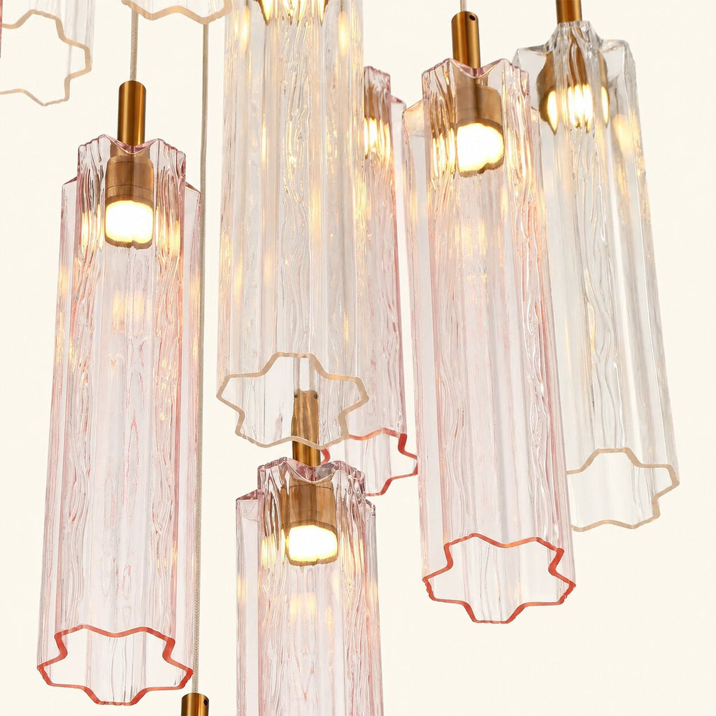 Chandelier with transparent pink and gold glass shades on a white background
