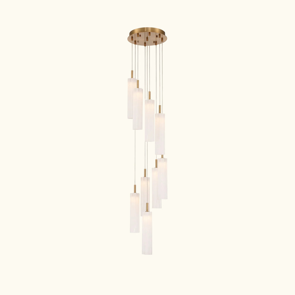 Modern pendant light with cylindrical glass shades on a white background