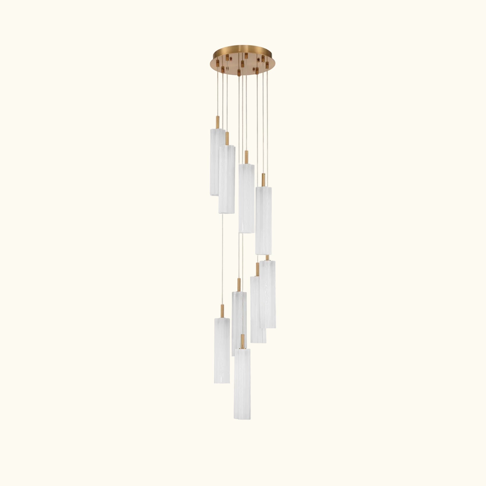A modern multi-light linear chandelier with a brushed gold ceiling canopy and multiple cylindrical frosted glass shades of varying lengths, suspended against a solid white background.