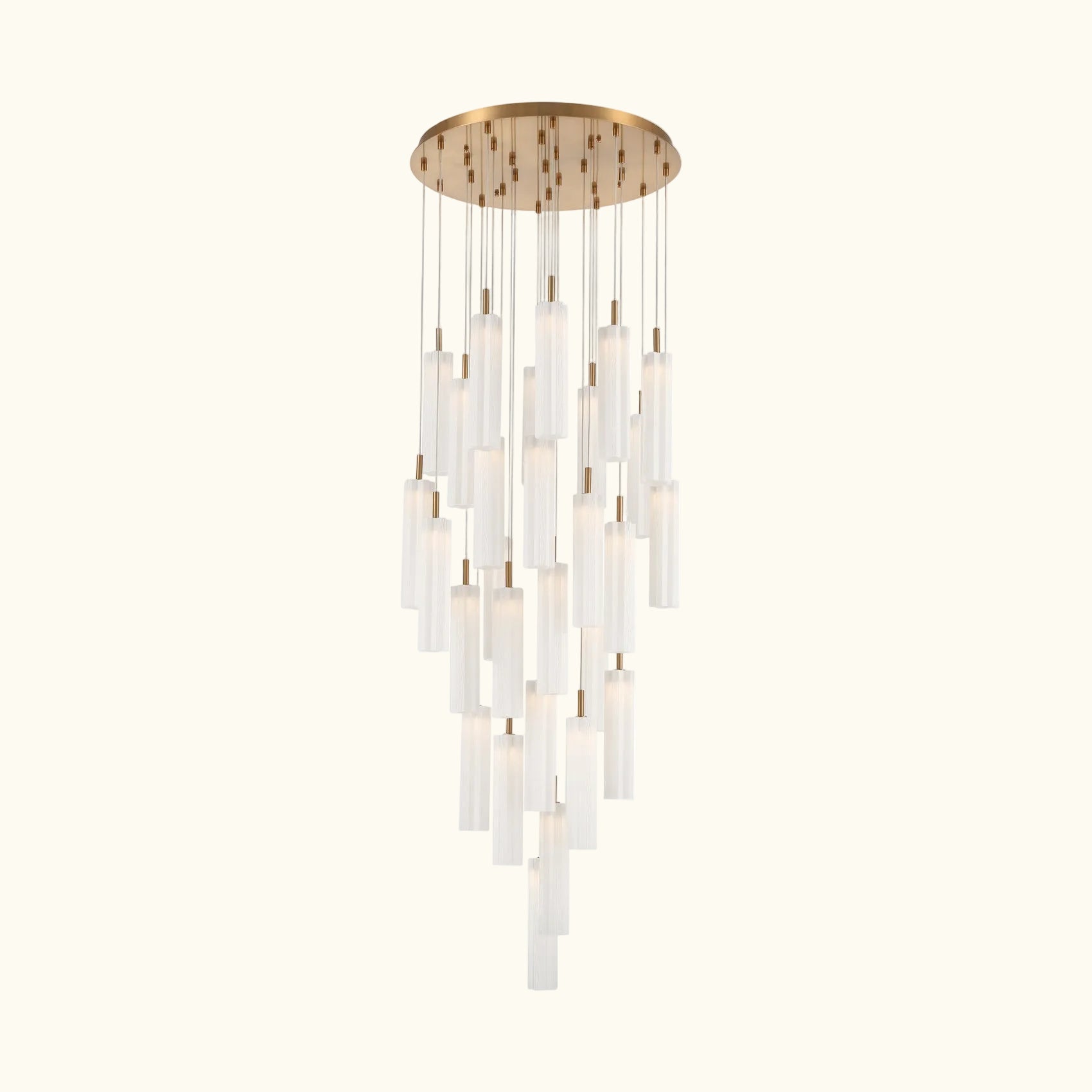A modern multi-light chandelier with a circular brushed gold ceiling canopy, multiple hanging clear glass cylindrical shades of varying lengths, and warm white light emission, shown against a plain white background.
