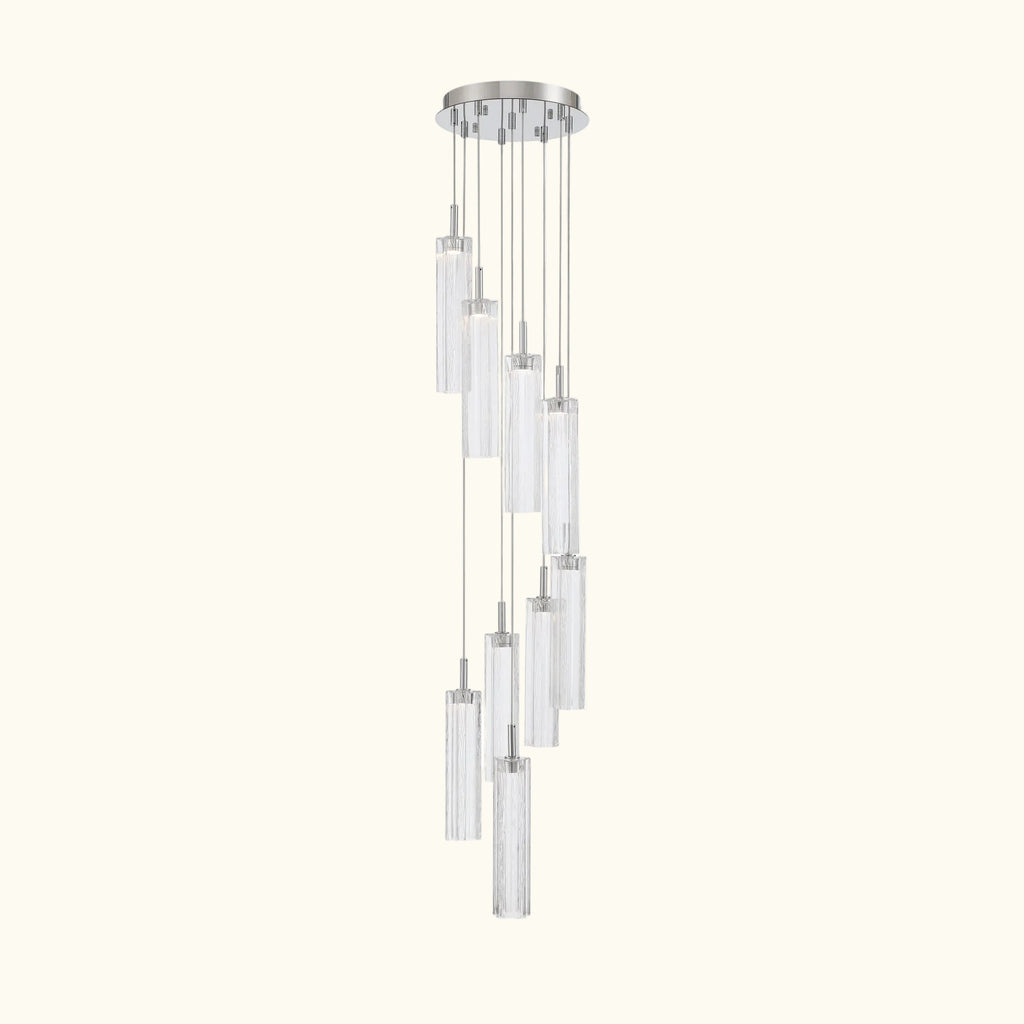 A modern multi-light linear chandelier with clear cylindrical glass shades and a polished silver-tone metal canopy and rods, shown against a plain white background.
