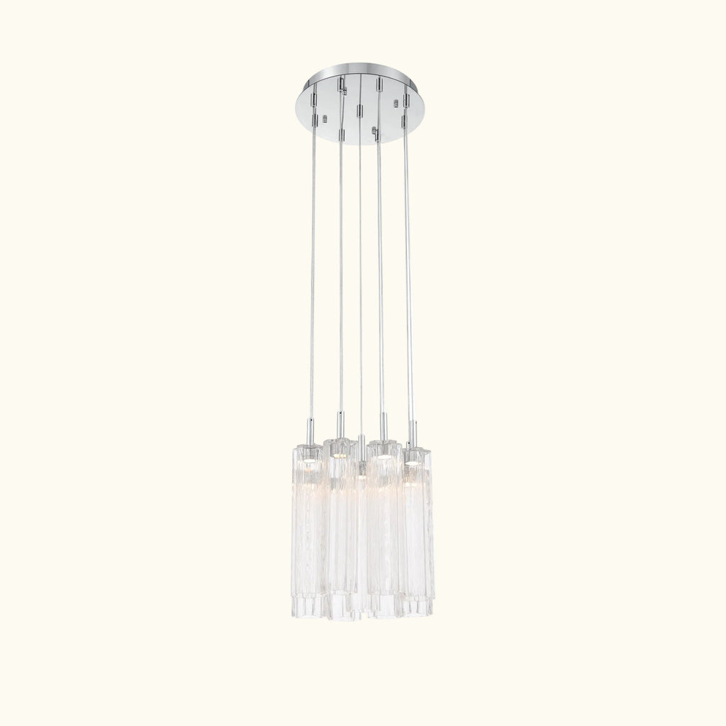 A modern multi-light linear pendant chandelier with a polished silver ceiling canopy and six clear glass cylindrical shades, shown against a plain white background.