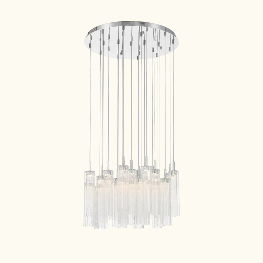 A modern multi-light chandelier with a circular silver canopy, multiple vertical silver rods, and clear cylindrical glass shades, shown against a plain white background.