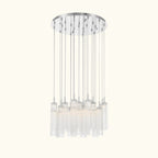 A modern multi-light chandelier with a circular silver canopy, multiple vertical silver rods, and clear cylindrical glass shades, shown against a plain white background.
