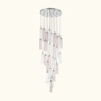 Chandelier with multiple cylindrical glass shades on a white background