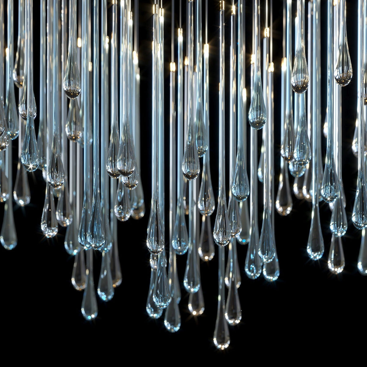 Crystal Tube Rain Chandelier chandelier in a tall interior