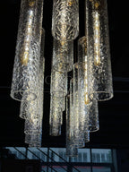 Colleena hammered glass chandelier viewed from below, showing open cylinder shades