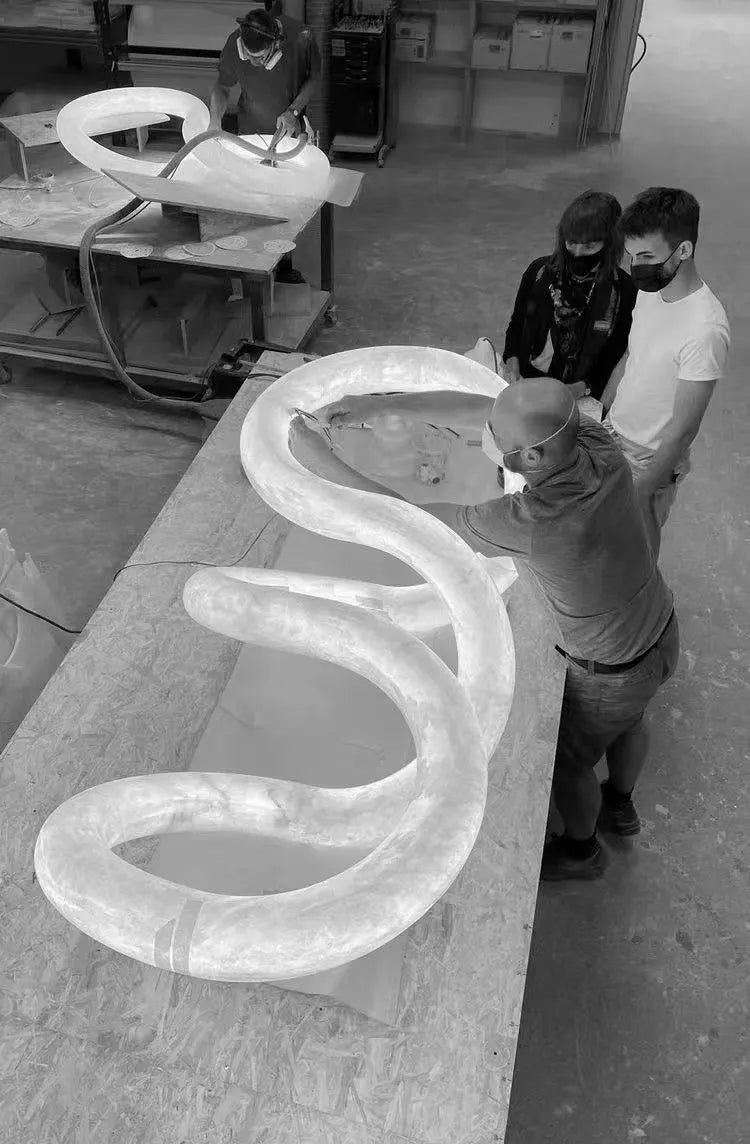 Streamlined Alabaster Linear And Curved Chandelier