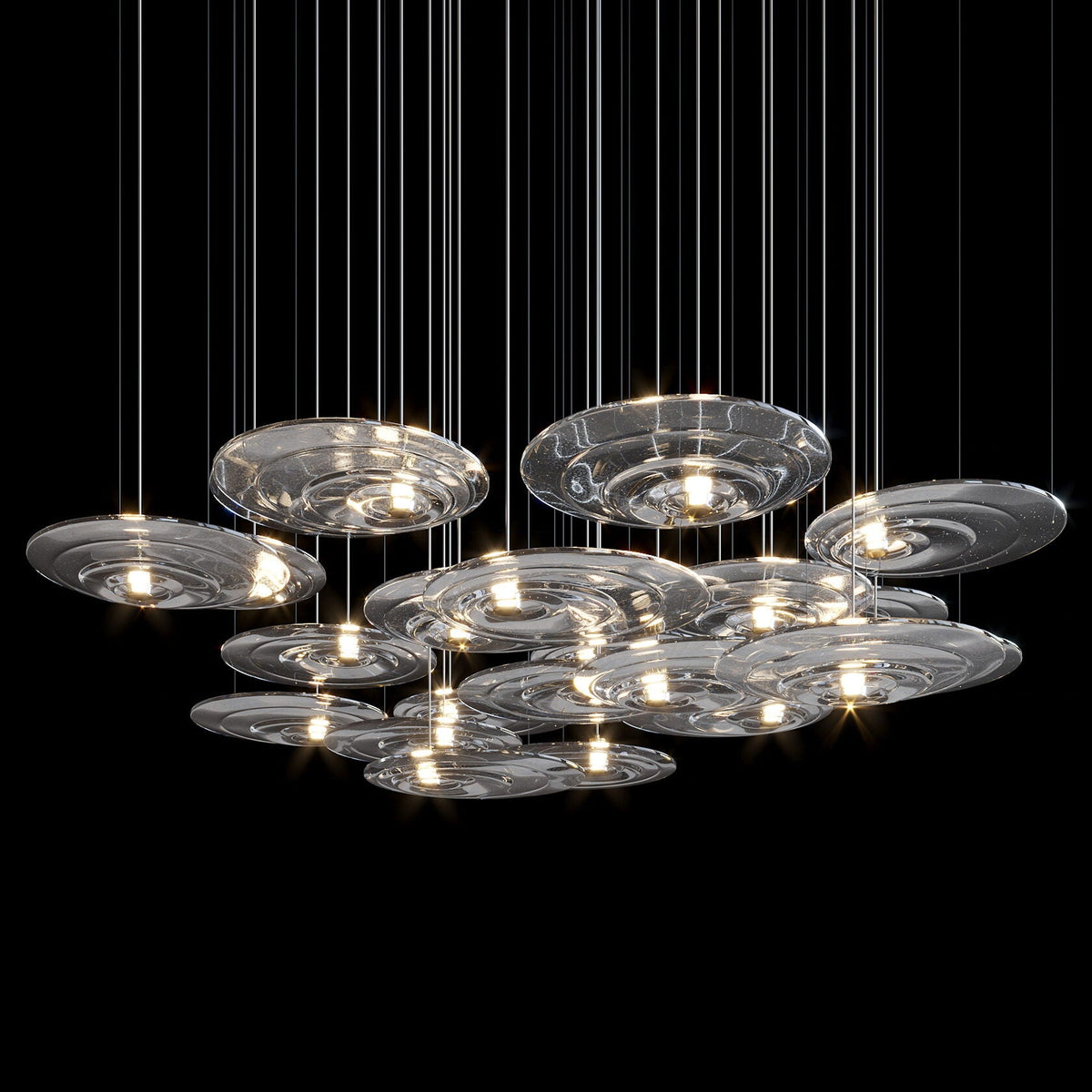 Amber Saucer Drift Chandelier chandelier in a tall interior