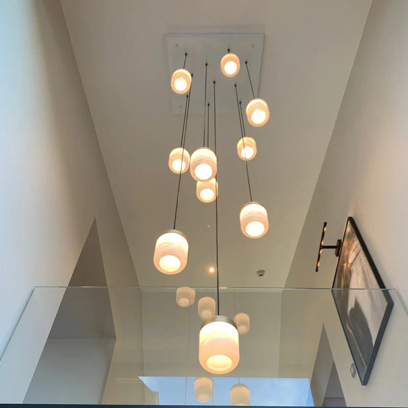 Alabaster Staircases Pendant Light chandelier in a tall interior