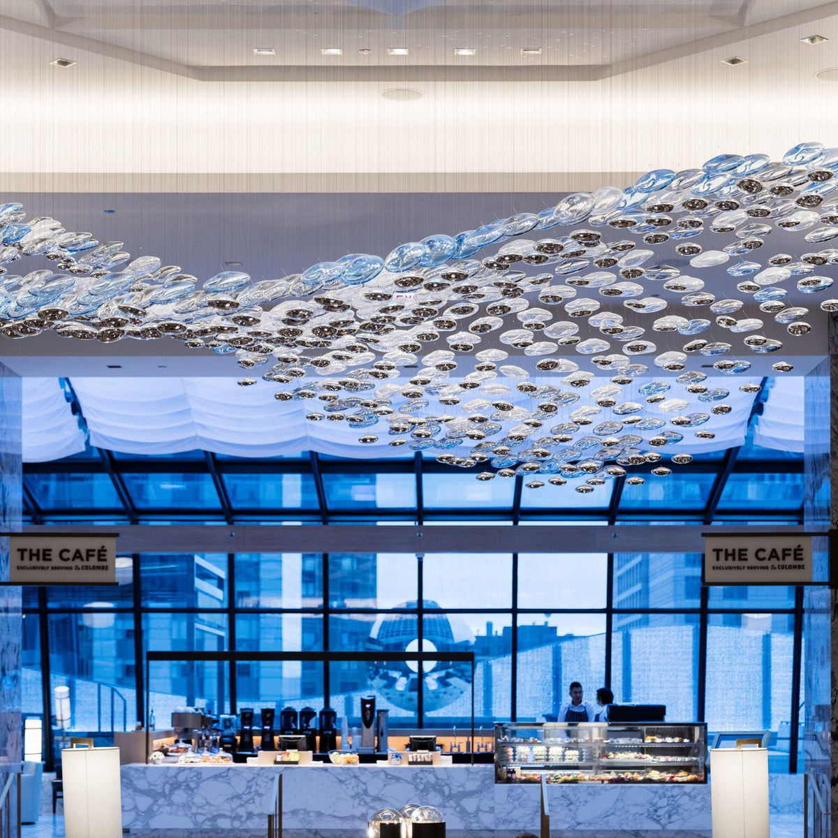 The Flying Surge LED Chandelier | Custom Size & Made-to-Order Lighting for Luxury Homes & Commercial Spaces chandelier in a tall interior