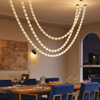 Riviere Glass Chain Chandelier installed above a dining table