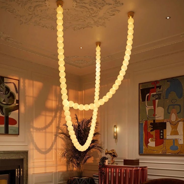 Halti Necklace Acrylic Chandelier chandelier in a tall interior