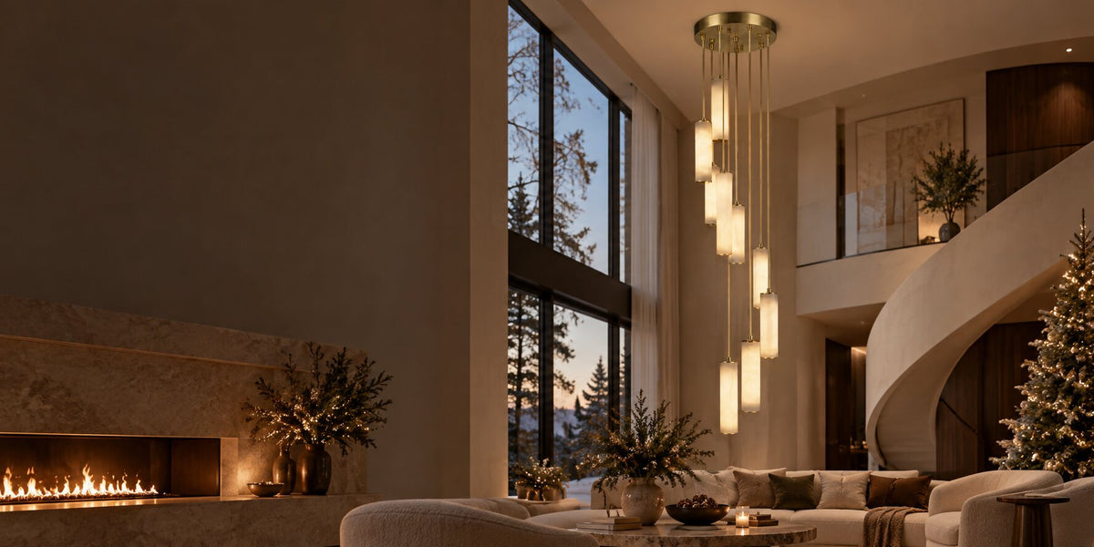 Multi-light cascade chandelier above a seating area in a double-height foyer with holiday decorations.