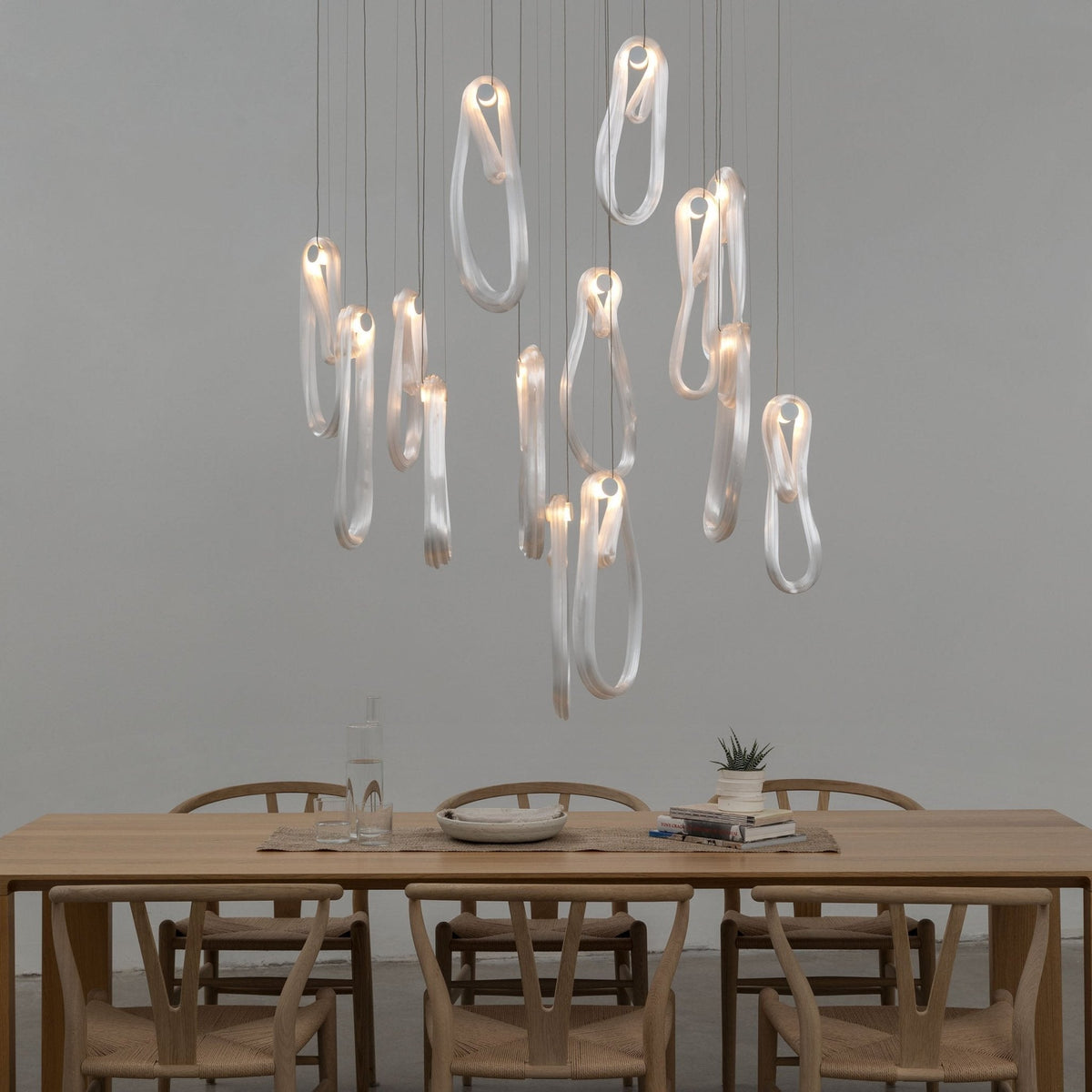 Pearlescent Filament Chandelier chandelier in a tall interior