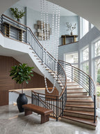 Riviere Glass Chain Chandelier installed in a double-height staircase