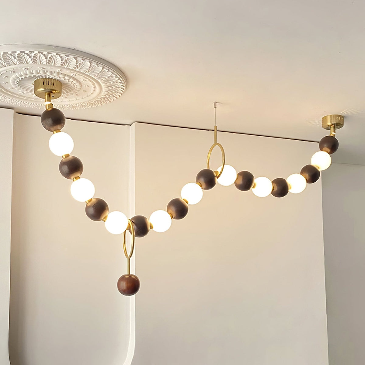 Walnut Bead Necklace Chandelier chandelier in a tall interior