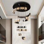 Aysha Black Crystal High Ceiling Entryway Light Fixture installed beside a staircase with cascading crystal strands