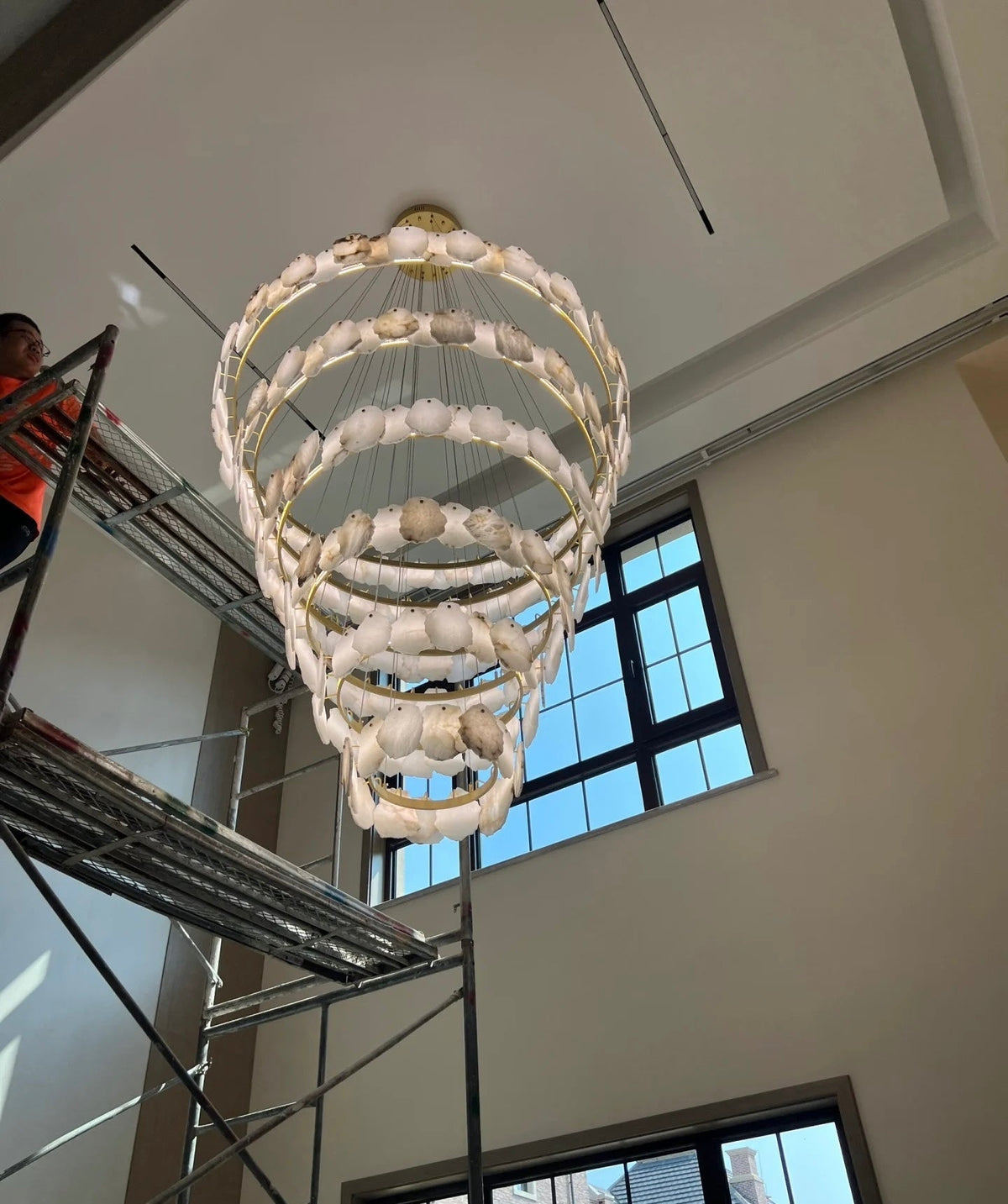 Modern Multi-layer White Alabaster Chandelier for Staircase/Foyer chandelier in a tall interior