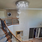 Ball Design Extra Large Crystal Chandelier for High Ceiling hanging beside a spiral staircase