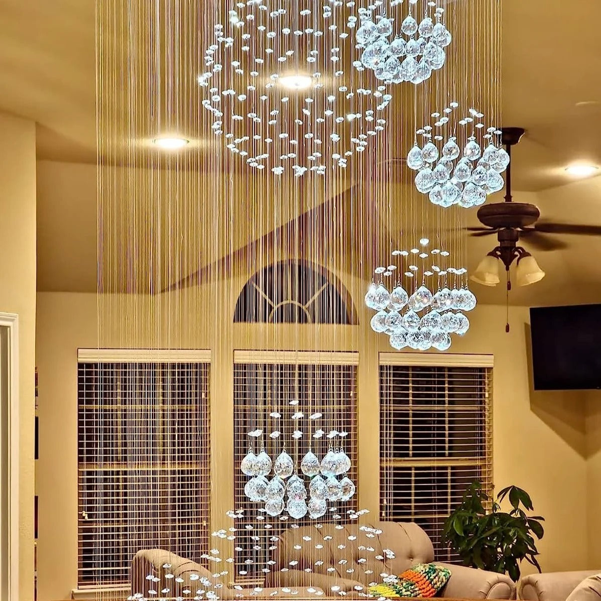Ball Design Extra Large Crystal Chandelier for High Ceiling installed in a staircase entryway