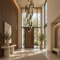 Black modern minimalist stick chandelier in high ceiling entryway