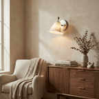 Alabaster Angled Wall Sconce — product setting and fixture profile, a tapered stone shade on an angled metal stem (view 2)