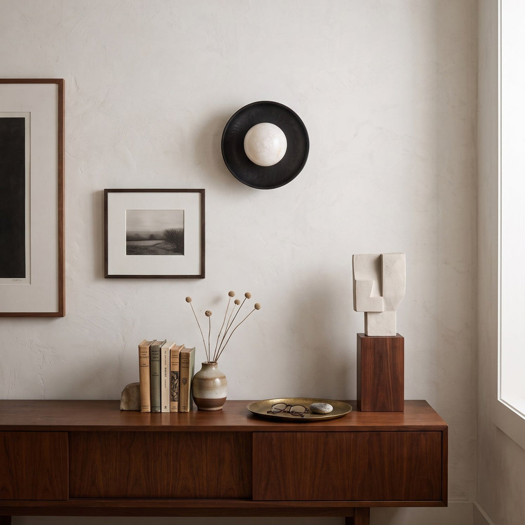 Aosta Disc Alabaster Wall Sconce — product setting and fixture profile, a stone globe in front of a textured brass disc (view 2)