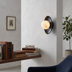 Aosta Disc Alabaster Wall Sconce — additional product view, a stone globe in front of a textured brass disc (view 3)