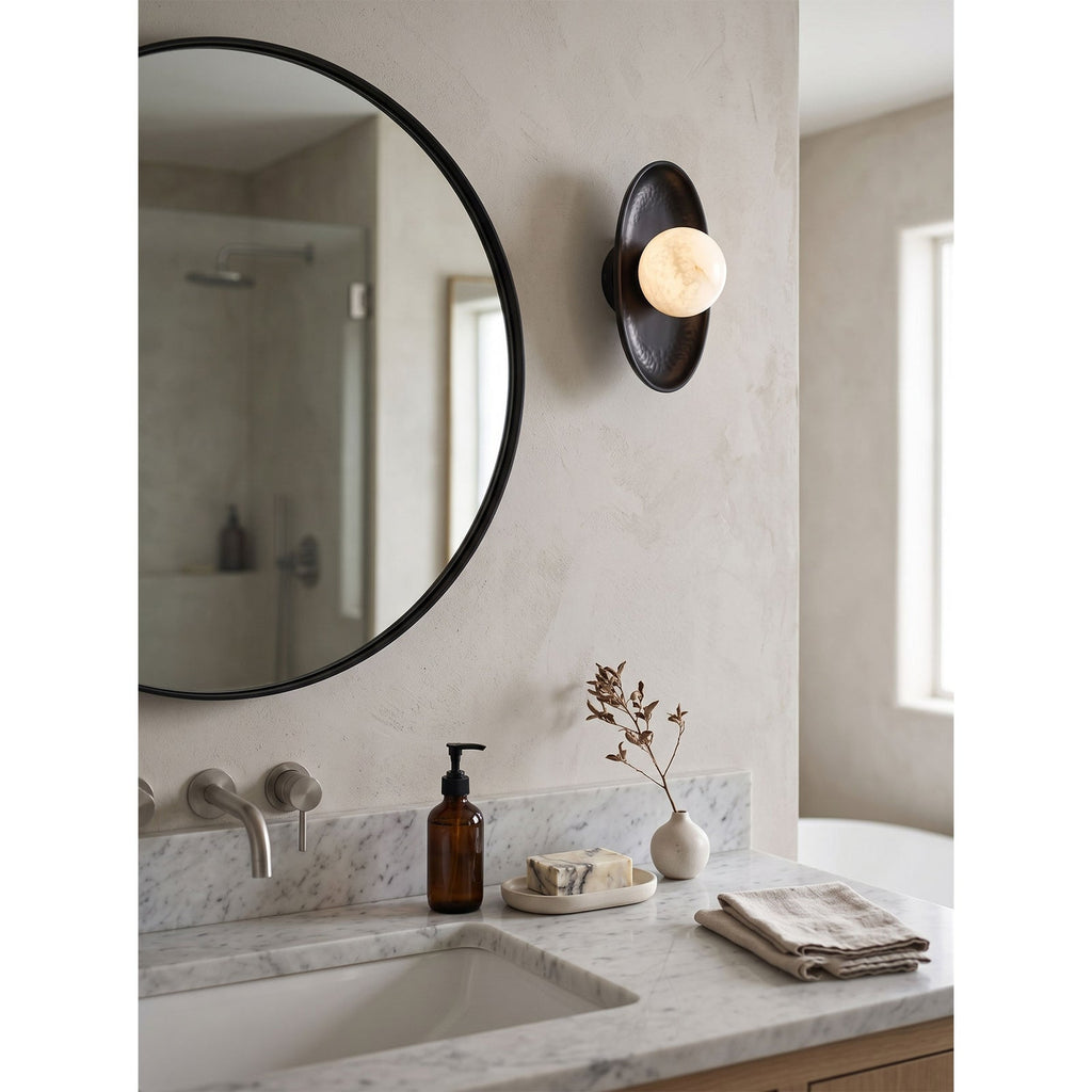 Aosta Disc Alabaster Wall Sconce — additional product view, a stone globe in front of a textured brass disc (view 5)